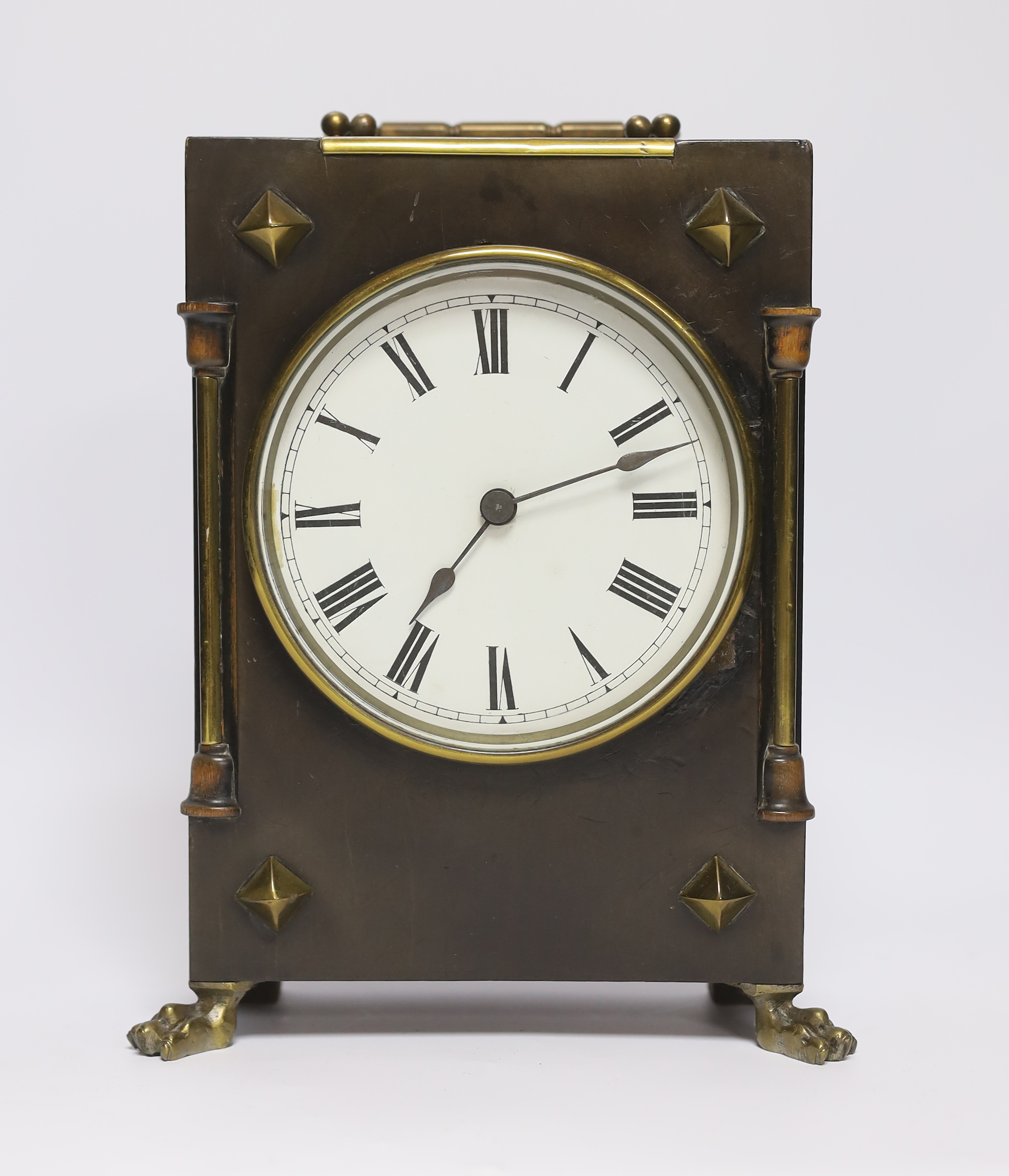 A small late 19th century ebonised mantel timepiece with studded case, 26cm